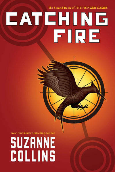 Catching Fire by Suzanne Collins: red and orange hardcover edition cover with a bird inside a circular emblem.